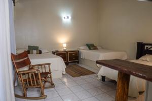 Postel nebo postele na pokoji v ubytování Hotel y Cabinas del Trópico