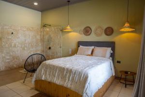 Postel nebo postele na pokoji v ubytování Hotel y Cabinas del Trópico