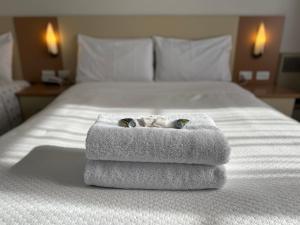 Postel nebo postele na pokoji v ubytování Motel Margeurita + 35 fotografií