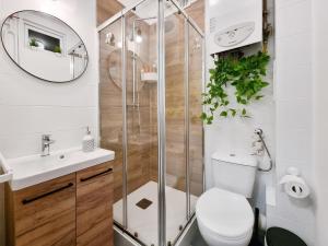 a bathroom with a shower and a toilet and a sink at CLASSY APARTMENTS - Gdynia - Experyment in Gdynia