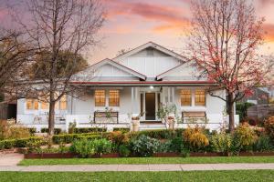 a white house with a garden in front of it at 'Haylock' Luxe Country Charm in Mudgee's Centre in Mudgee