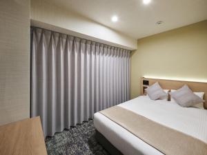 Postel nebo postele na pokoji v ubytování Hotel Villa Fontaine Tokyo-Kayabacho