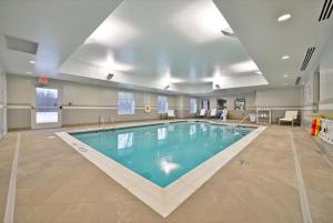 a large swimming pool in a large room at Holiday Inn Express Canandaigua, an IHG Hotel in Canandaigua