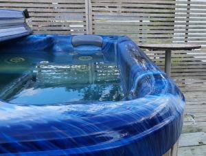 a large inflatable pool with a blue water slide at Dream Weavers Farm Cabin in Karetu