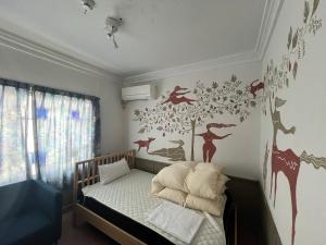 Postel nebo postele na pokoji v ubytování 遊廓荘