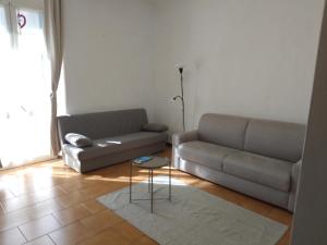 a living room with a couch and a table at Casa marzia in La Spezia