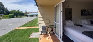 Voodi või voodid majutusasutuse Lake Dunstan Motel toas
