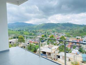 a balcony with a view of a city at Kottagala White House in Kotagala
