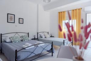 Кровать или кровати в номере Muses_Calliope, Chios