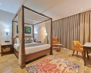 Postel nebo postele na pokoji v ubytování Residency Hotel Fort