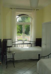 a bedroom with a bed and a window at Ferienwohnung Mosel-Rhein in Koblenz