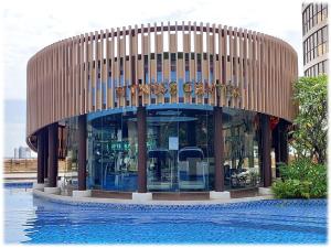 a building with a sign on the front of it at Ideal Budget and Cozy Private Studio with Amazing Pool by SYM C738 in Phnom Penh