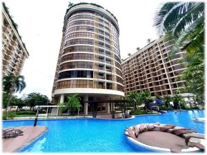 a large building with a large swimming pool at Ideal Budget and Cozy Private Studio with Amazing Pool by SYM C738 in Phnom Penh