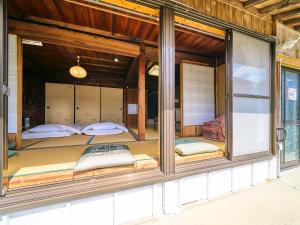 Postel nebo postele na pokoji v ubytování Kokoyui Guest House