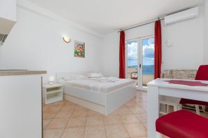 Postel nebo postele na pokoji v ubytování Sita Apartmani