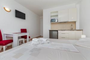 Postel nebo postele na pokoji v ubytování Sita Apartmani