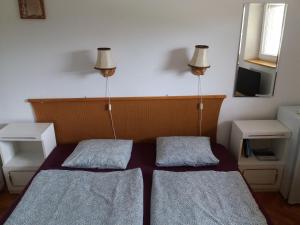 Posteľ alebo postele v izbe v ubytovaní Badacsonyi Lugas apartmanok