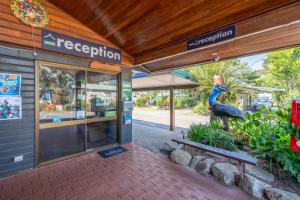 a store with a large peacock statue in front of it at BIG4 Tasman Holiday Parks - South Mission Beach in South Mission Beach