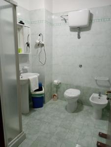 a bathroom with a toilet and a sink at Mamma Assunta in Melendugno +48 photos