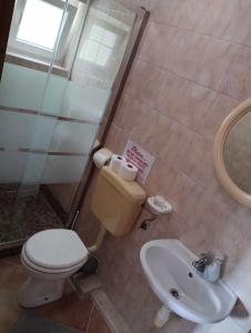 a bathroom with a toilet and a sink at Apartment Keti in Čižići
