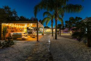 a house with a pavilion with lights on it at WaterWheel Villa by Fidalsa in Almoradí