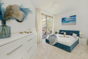 a bedroom with a bed and a large window at Apartment in Pobierowo near Baltic Beach in Pobierowo +23 photos