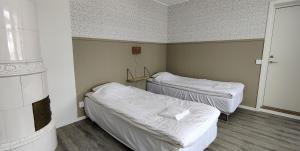 Ένα ή περισσότερα κρεβάτια σε δωμάτιο στο Villa Nostan