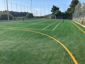 a tennis court with two tennis courts at Villaggio Passo Dell'Arciprete in Vieste