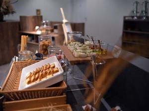 a table with a bunch of food on it at WeBase KAMAKURA in Kamakura