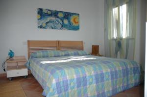 A bed or beds in a room at Regina