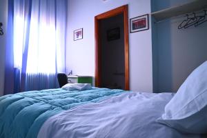 a large bed in a bedroom with a window at Villa San Giuseppe Brindisi in Brindisi