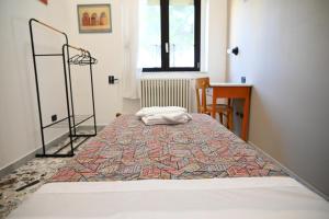 a large bed in a room with a bedspread on it at Villa San Giuseppe Brindisi in Brindisi