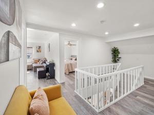 a living room with a couch and a bedroom at Super Spacious Family Vacation House! in San Diego