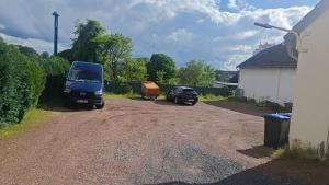 a blue truck parked on a dirt road at Top Apartment Nähe Geilenkirchen, Heinberg und Übach Palenberg 90qm für 6 Personen in Geilenkirchen