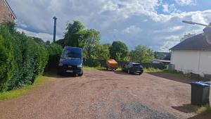 a blue truck parked on the side of a dirt road at Top Apartment Nähe Geilenkirchen, Heinberg und Übach Palenberg 90qm für 6 Personen in Geilenkirchen +1 photo