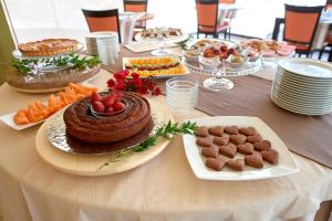 a table with a table with food on it at Baglio Dello Zingaro in Scopello