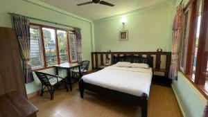 Un pat sau paturi într-o cameră la Nanohana Lodge