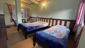 Giường trong phòng chung tại Nanohana Lodge