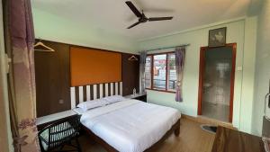 Giường trong phòng chung tại Nanohana Lodge