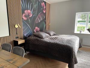Postel nebo postele na pokoji v ubytování Jonstrupvejens Apartments Lejl D