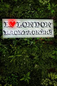 a sign on a bush with a heart on it at London Backpackers Youth Hostel 18 - 35 Years Old Only in London