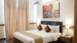 Postel nebo postele na pokoji v ubytování Amarelo Hotel Solo