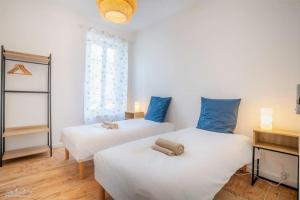 Ένα ή περισσότερα κρεβάτια σε δωμάτιο στο Escale à Nantes - Bord de Loire