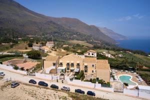 an aerial view of a house on a hill at Baglio Dello Zingaro in Scopello