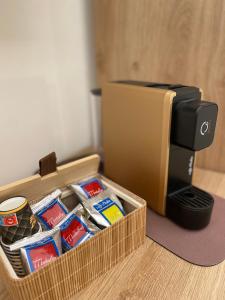 a box of instant coffee next to a toaster at LIMU casa vacanze in Lampedusa