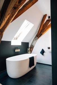 Ванная комната в L'appartement De Pastorie Alsemberg