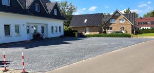 a street with a house and some orange cones at Fewo Traum in Neppermin