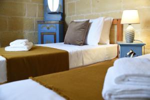 Letto o letti in una camera di Gawhra B&B