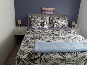 Кровать или кровати в номере Apartmani Zoran