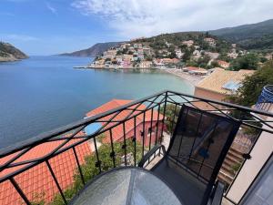 a view of a body of water from a balcony at La casa sulle rocce House on the rocks in Asos